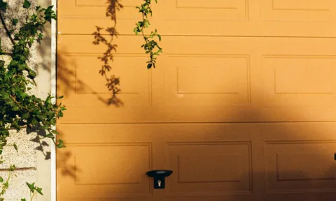Sectional garage door panels on a Spokane home, the kind of door serviced during panel repair